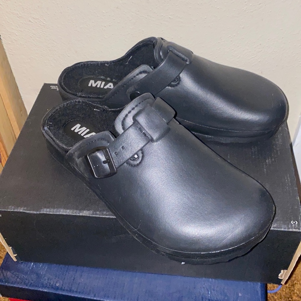 Black lined slip on clogs
